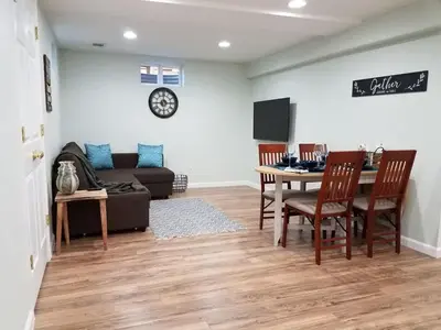 a living room with a couch and a table at Renovated 2BR flat near Red Rocks-Rocky Mt-DT-15min in Golden
