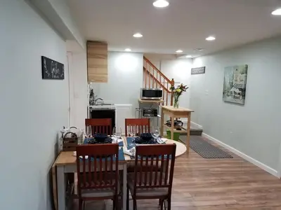 a dining room with a table and four chairs at Renovated 2BR flat near Red Rocks-Rocky Mt-DT-15min in Golden