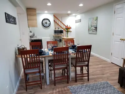 a kitchen and dining room with a table and chairs at Renovated 2BR flat near Red Rocks-Rocky Mt-DT-15min in Golden