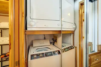a washer and dryer in a small room at 4 Mi to Slopes! Breck Mtn Base with Hot Tub Access in Breckenridge
