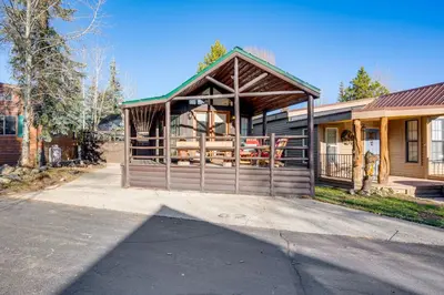 a house with a porch on the side of it at 4 Mi to Slopes! Breck Mtn Base with Hot Tub Access in Breckenridge
