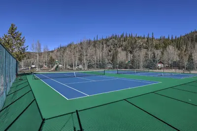 a tennis court with two tennis courts at 4 Mi to Slopes! Breck Mtn Base with Hot Tub Access in Breckenridge