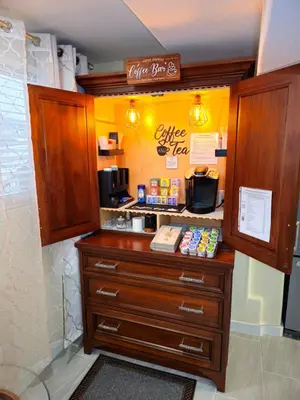 a coffee shop with a dresser in a room at Stylish Denver Apartment Near Downtown Sleeps 4 in Denver