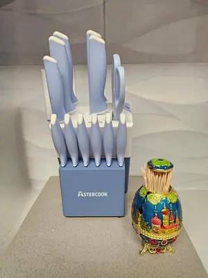 a knife set in a blue box next to a vase at Stylish Denver Apartment Near Downtown Sleeps 4 in Denver