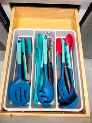 a plastic tray with utensils in a drawer at Stylish Denver Apartment Near Downtown Sleeps 4 in Denver