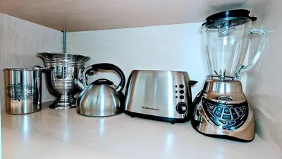 a shelf with a blender and other appliances on it at Stylish Denver Apartment Near Downtown Sleeps 4 in Denver