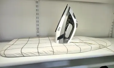 a iron is sitting on top of a shelf at Stylish Denver Apartment Near Downtown Sleeps 4 in Denver