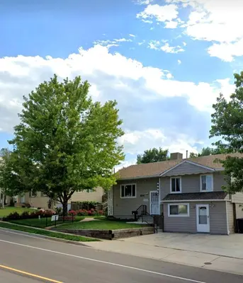 a house on the side of the road at Stylish Denver Apartment Near Downtown Sleeps 4 in Denver