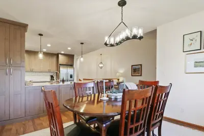 a kitchen and dining room with a wooden table and chairs at 97 Lookout Ridge townhouse in Dillon