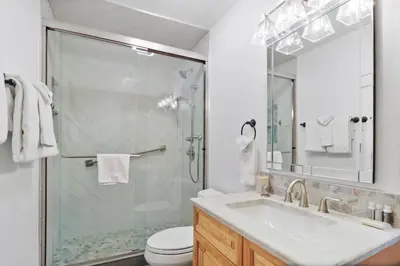 a bathroom with a shower and a sink and a toilet at 97 Lookout Ridge townhouse in Dillon