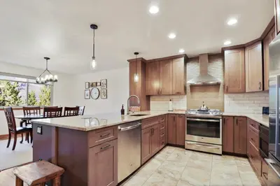 a kitchen with wooden cabinets and a dining room at 97 Lookout Ridge townhouse in Dillon