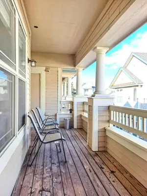 a porch with two chairs on a house at Bright Airy Home with Scenic Views in Littleton