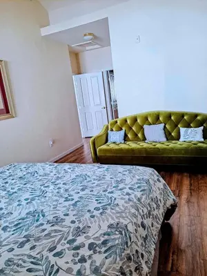 a living room with a couch and a bed at Bright Airy Home with Scenic Views in Littleton