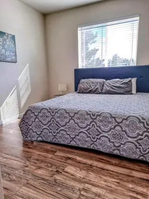 a bedroom with a bed and a large window at Bright Airy Home with Scenic Views in Littleton