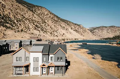 a row of houses on the shore of a river at Lakefront - Trails - Skiing - Views - Georgetown in Georgetown