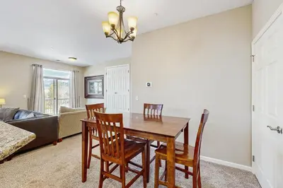 a kitchen and dining room with a table and chairs at Timbers at the Pines in Fraser