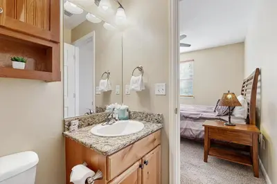 a bathroom with a sink and a mirror at Timbers at the Pines in Fraser