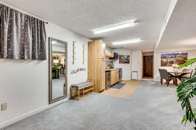 a living room with a kitchen and a dining room at Cozy Boulder Basement Unit Upscale Outdoor Space! in Boulder