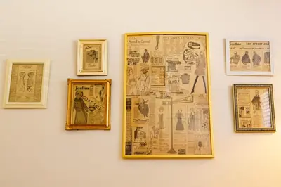 a wall with papers and pictures on a wall at Retro 70s Styled Home 15 min to Downtown in Denver