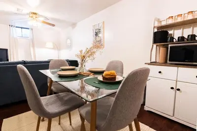 a dining room with a table and chairs at Retro 70s Styled Home 15 min to Downtown in Denver