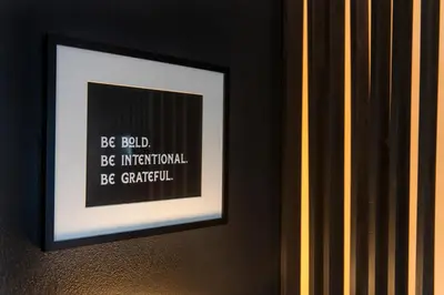 a picture of a framed picture on a wall at Walkable Rooftop Retreat 2BR, Workspace & BBQ in Denver