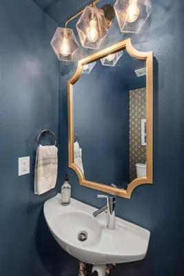 a bathroom with a sink and a mirror at Walkable Rooftop Retreat 2BR, Workspace & BBQ in Denver