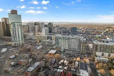an aerial view of a city with tall buildings at Walkable Rooftop Retreat 2BR, Workspace & BBQ in Denver
