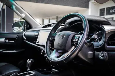 a car steering wheel with a green hose on it at Yougeen in Denver