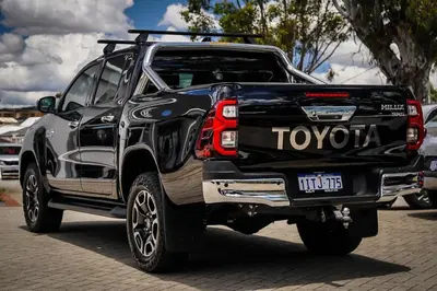 a black and white truck parked on a street at Yougeen in Denver