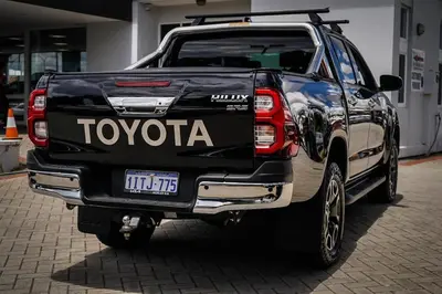 a black toyota truck parked in a garage at Yougeen in Denver