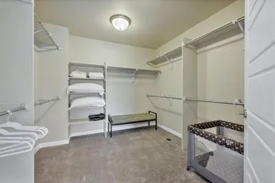 a walk in closet with shelves and towels at Family Friendly 5BR Mountain Views & Game Room in Superior