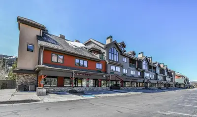 a large building on the side of a street at Gateway Lodge 5008 by SummitCove Lodging in Keystone