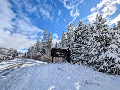 a sign on the side of a snow covered road at Gateway Lodge 5008 by SummitCove Lodging in Keystone