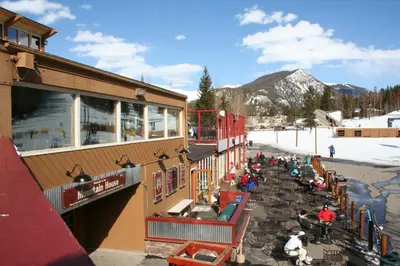a group of people sitting outside of a building at Gateway Lodge 5008 by SummitCove Lodging in Keystone