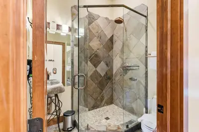 a shower with a glass door in a bathroom at 508 Ravenwood A-3 in Grand Lake