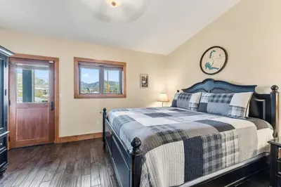 a bedroom with a bed and a window at 508 Ravenwood A-3 in Grand Lake