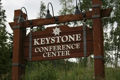 a sign for the kynesoperative conference center at Quicksilver 1674 by SummitCove Lodging in Keystone