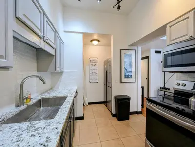 a kitchen with a sink and a microwave at Quicksilver 1674 by SummitCove Lodging in Keystone