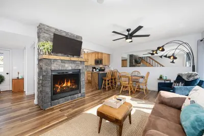 a living room with a fireplace and a couch at Soda Springs Ranch Unit 3C in Grand Lake