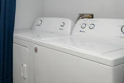 two white sinks sitting on top of a washing machine at Soda Springs Ranch Unit 3C in Grand Lake