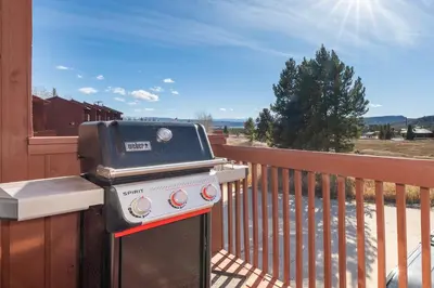a barbecue grill on a balcony on a porch at Soda Springs Ranch Unit 3C in Grand Lake