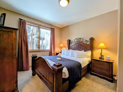 a bedroom with a large bed and a window at Keystone Retreat 33 by SummitCove Lodging in Keystone