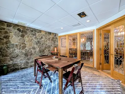 a dining room with a wooden table and chairs at Chateaux DuMont 2710 by SummitCove Lodging in Keystone