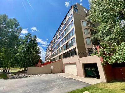 a building with a parking lot in front of it at Decatur 1805 by SummitCove Lodging in Keystone