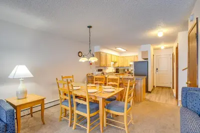 a dining room and kitchen with a table and chairs at Walk to Main St! Ultimate Winter Park Getaway in Winter Park