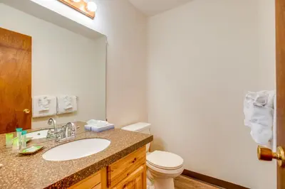 a bathroom with a sink and a toilet at Walk to Main St! Ultimate Winter Park Getaway in Winter Park