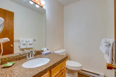 a bathroom with a sink and a toilet at Heated Pool and Hot Tub! Winter Park Mtn Retreat in Winter Park