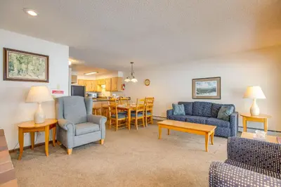 a living room with a couch and chairs and a table at Pool and Hot Tub! Hub for All-Season Winter Park Fun in Winter Park