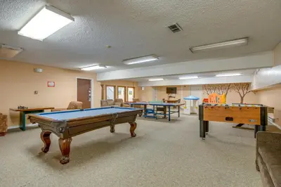 a large room with two pool tables in it at 3 Mi to Winter Park Slopes! Unit with Pool and Hot Tub in Winter Park