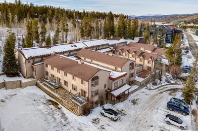 an aerial view of a large house in the snow at 3 Mi to Winter Park Slopes! Unit with Pool and Hot Tub in Winter Park